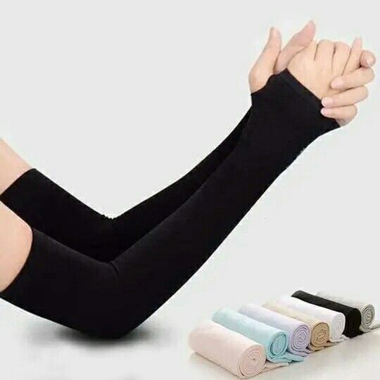Black arm sleeve being worn on a white background with additional sleeves stacked below.